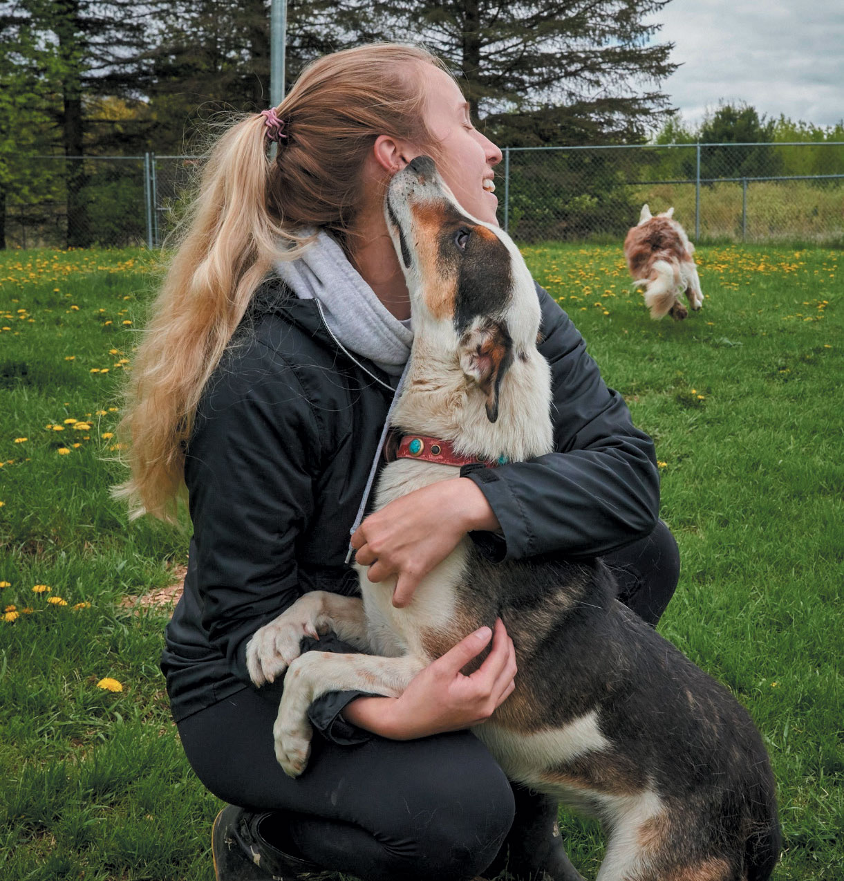 eorgia giving kisses to Brenna, one of Home for Life’s® animal care specialists 
