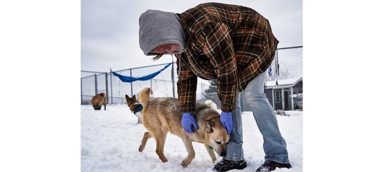 Ben with aide in the snow